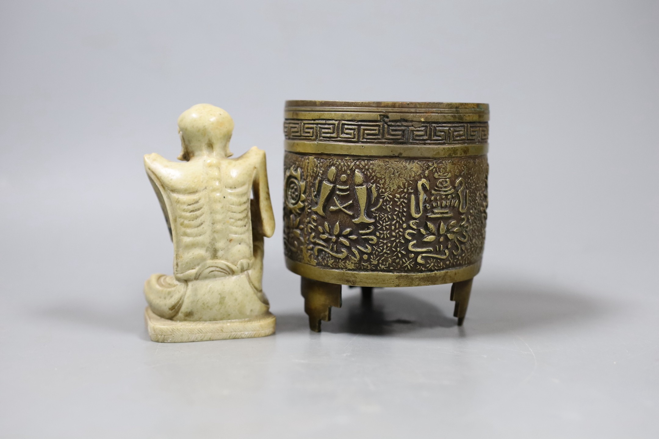 A Chinese archaistic bronze censer and a soapstone figure of a luohan, Tallest 10cm